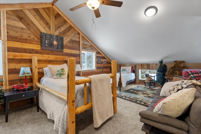 4695 Star Meadow Rd, Whitefish, MT 59937 - bedroom featuring lofted ceiling, wood walls, and carpet flooring
