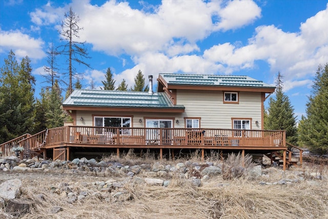 4695 Star Meadow Rd, Whitefish, MT 59937 - back of property with a deck and stairs