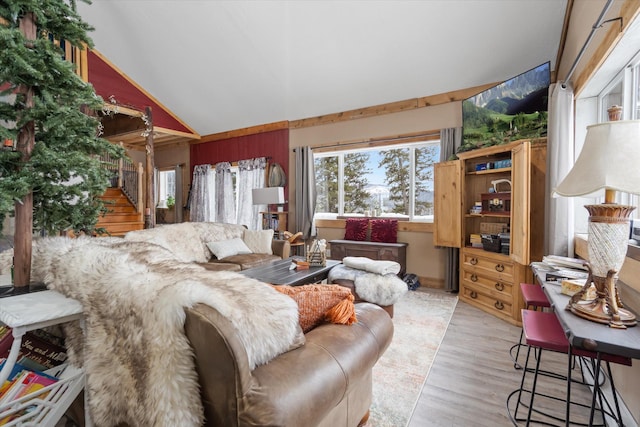 4695 Star Meadow Rd, Whitefish, MT 59937 - living room with plenty of natural light, wood finished floors, and vaulted ceiling