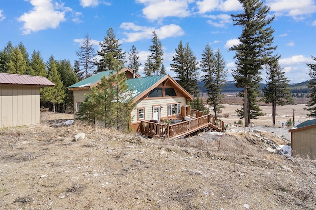 4695 Star Meadow Rd, Whitefish, MT 59937 - back of house featuring a deck and a metal roof