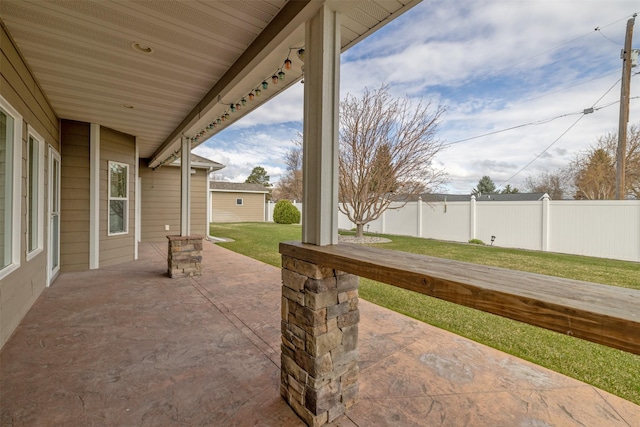 view of patio / terrace featuring fence