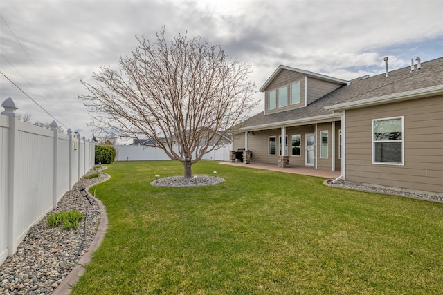 view of yard with a patio and a fenced backyard