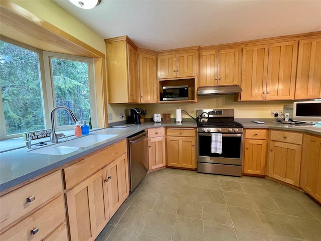 69 Fir Dr, Thompson Falls, MT 59873 - kitchen with light brown cabinets, light tile patterned flooring, under cabinet range hood, stainless steel appliances, and a sink