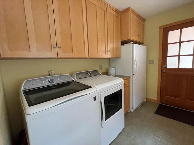 69 Fir Dr, Thompson Falls, MT 59873 - clothes washing area featuring washing machine and dryer, light tile patterned floors, and cabinet space