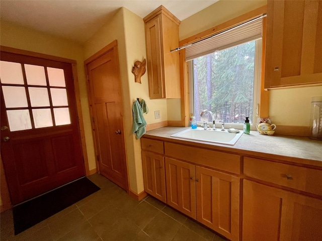 69 Fir Dr, Thompson Falls, MT 59873 - kitchen featuring dark tile patterned flooring and a sink