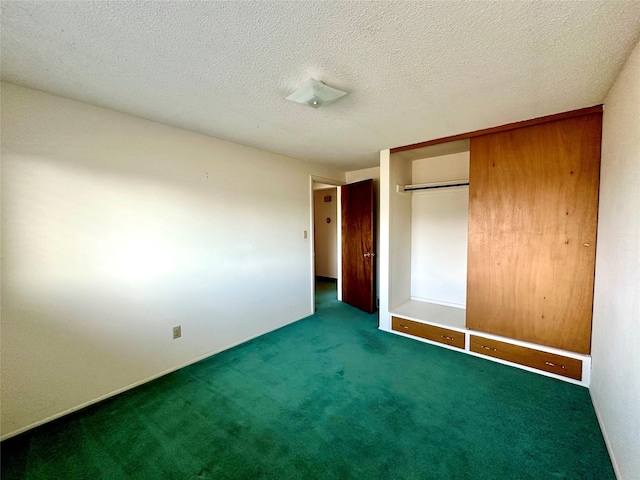 unfurnished bedroom with a closet, a textured ceiling, and carpet floors