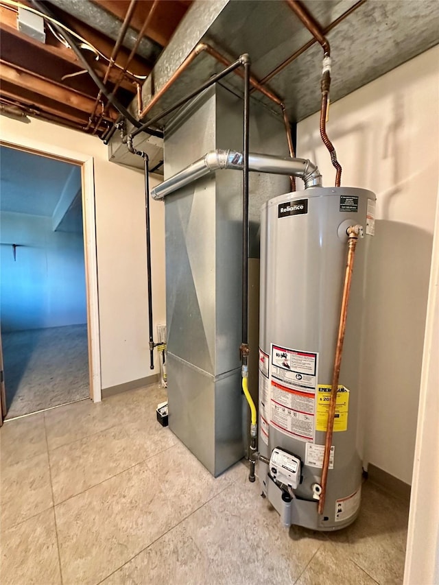 utility room featuring water heater