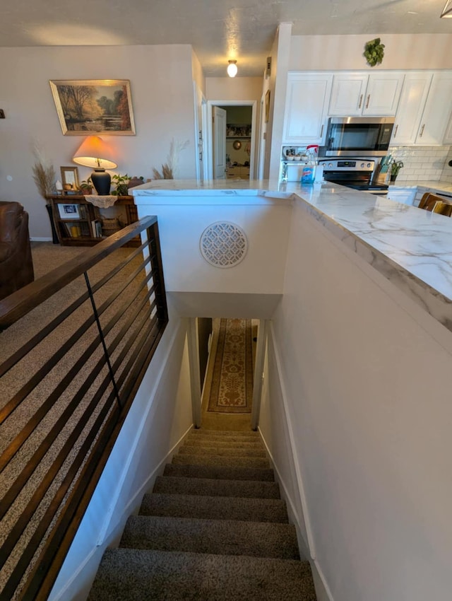 stairs featuring baseboards