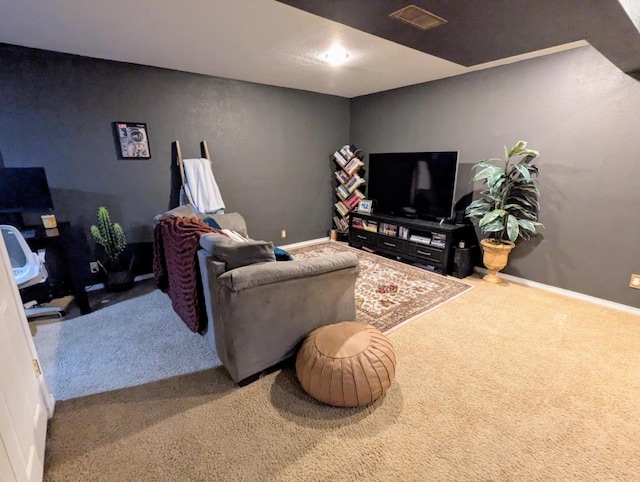 living area with carpet and baseboards