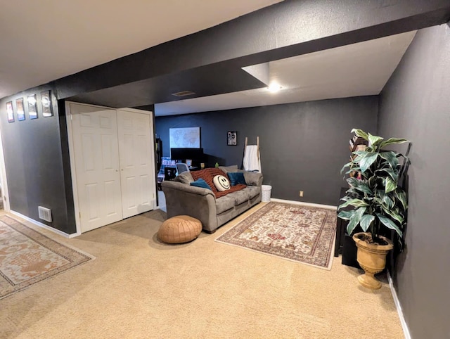 living room featuring carpet flooring, baseboards, and visible vents