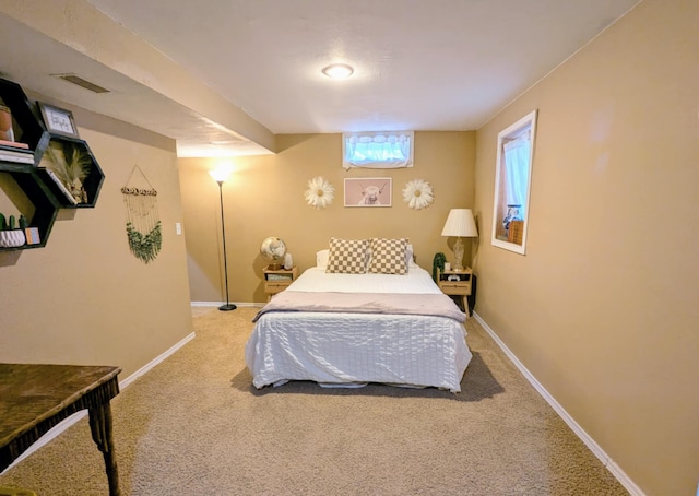 bedroom with baseboards, carpet, and visible vents