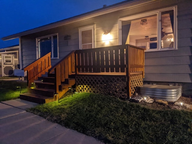 view of exterior entry at night