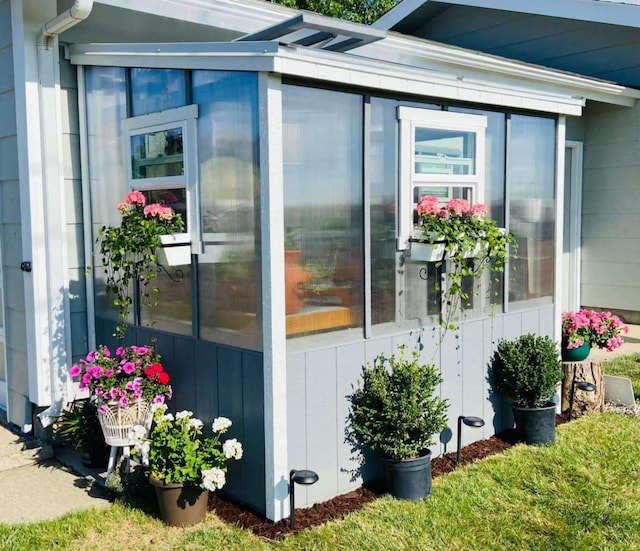 view of home's exterior featuring a sunroom
