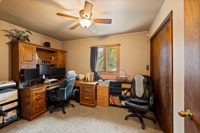 office with ceiling fan, light carpet, and a textured ceiling