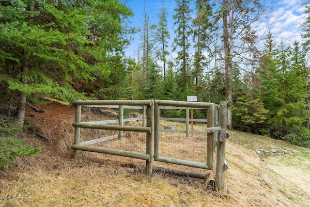 view of gate with fence