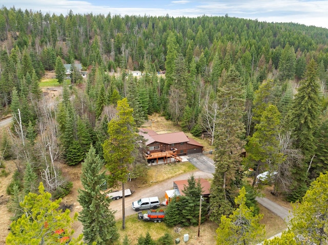 aerial view featuring a wooded view