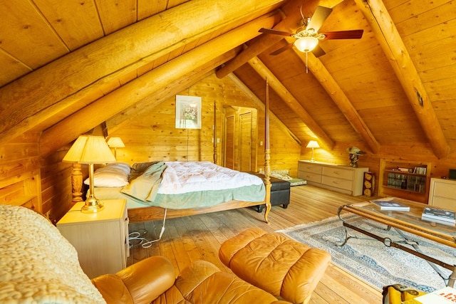 5228 Sophie Lake Rd, Eureka, MT 59917 - bedroom with wooden walls, wood-type flooring, and wooden ceiling