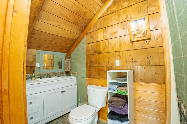 5228 Sophie Lake Rd, Eureka, MT 59917 - bathroom featuring lofted ceiling, toilet, wooden walls, vanity, and wood ceiling