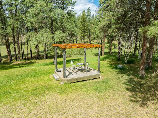 5228 Sophie Lake Rd, Eureka, MT 59917 - view of green lawn with a wooden deck