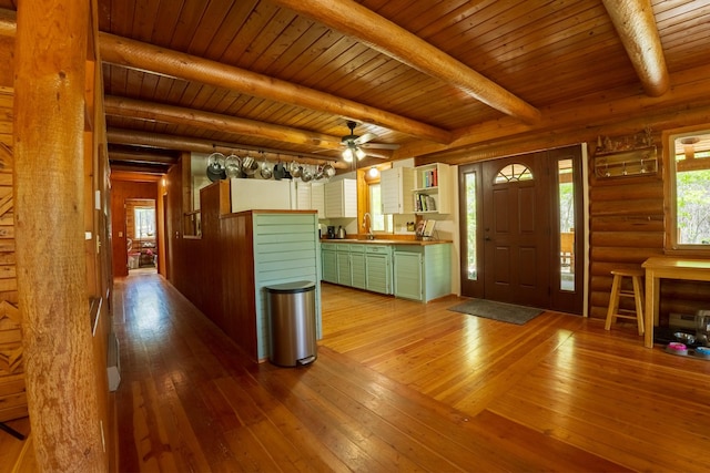5228 Sophie Lake Rd, Eureka, MT 59917 - entryway with hardwood / wood-style flooring, wooden ceiling with exposed beams, a ceiling fan, and rustic walls