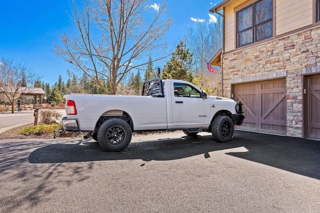 6104 Monterra Ave Unit A, Whitefish, MT 59937 - view of parking featuring an attached garage