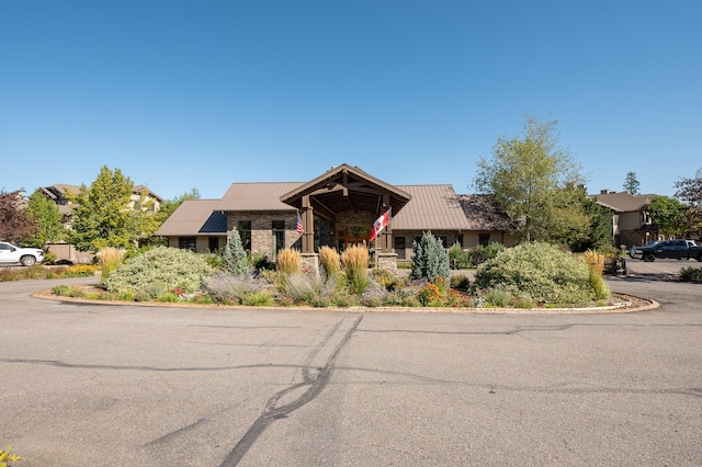 6104 Monterra Ave Unit A, Whitefish, MT 59937 - view of front of house with a metal roof and stone siding