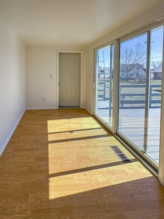 123 W Jefferson Ave, Chester, MT 59522 - doorway featuring light wood finished floors and baseboards