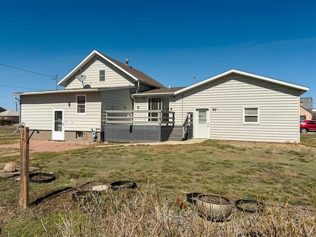 123 W Jefferson Ave, Chester, MT 59522 - back of property featuring a deck and a lawn
