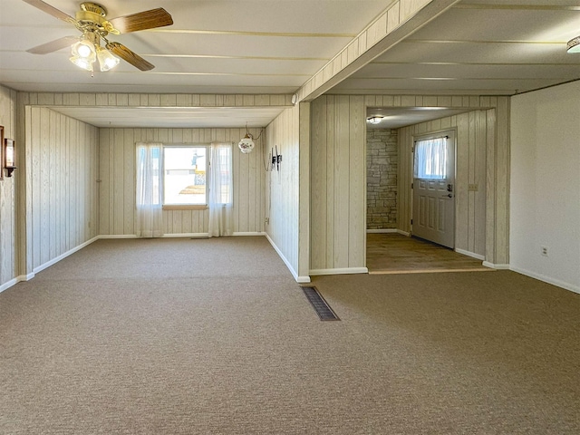 123 W Jefferson Ave, Chester, MT 59522 - carpeted spare room with a ceiling fan and wooden walls