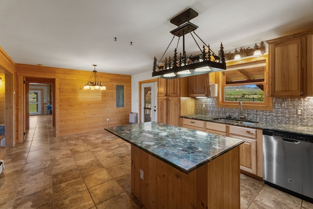 68 Bieler Ln, Sheridan, MT 59749 - kitchen featuring dishwasher, tasteful backsplash, wooden walls, a kitchen island, and pendant lighting