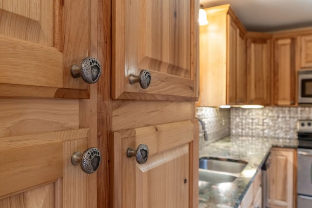 68 Bieler Ln, Sheridan, MT 59749 - kitchen featuring stainless steel electric range oven, backsplash, and white microwave