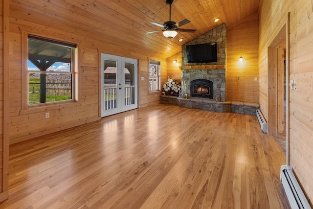 68 Bieler Ln, Sheridan, MT 59749 - unfurnished living room featuring baseboard heating, wood ceiling, french doors, vaulted ceiling, and light wood-style flooring