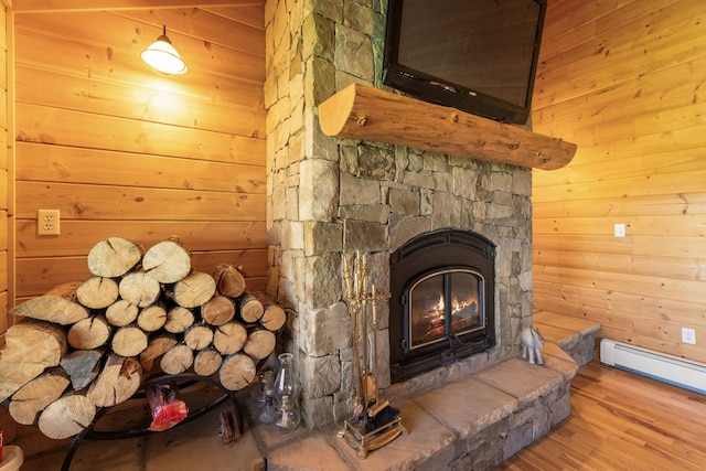 68 Bieler Ln, Sheridan, MT 59749 - detailed view of wood walls, wood finished floors, a fireplace, and baseboard heating