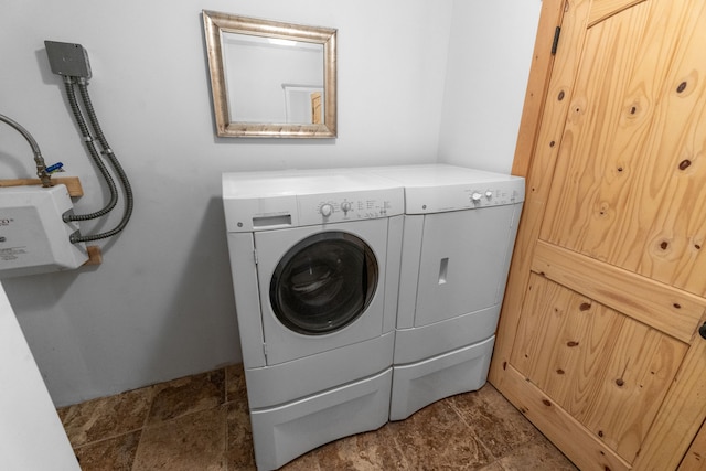 68 Bieler Ln, Sheridan, MT 59749 - laundry area featuring washer and dryer and stone finish flooring