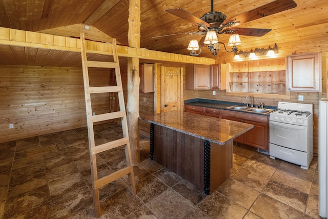 68 Bieler Ln, Sheridan, MT 59749 - kitchen featuring white range with gas stovetop, wood walls, wood ceiling, ceiling fan, and dark stone finish floors