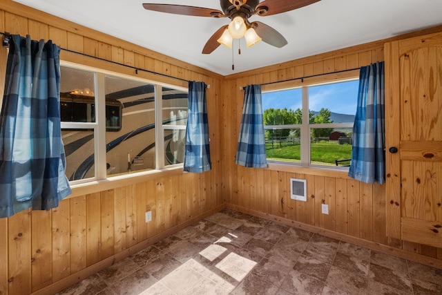 68 Bieler Ln, Sheridan, MT 59749 - empty room featuring wooden walls and a ceiling fan