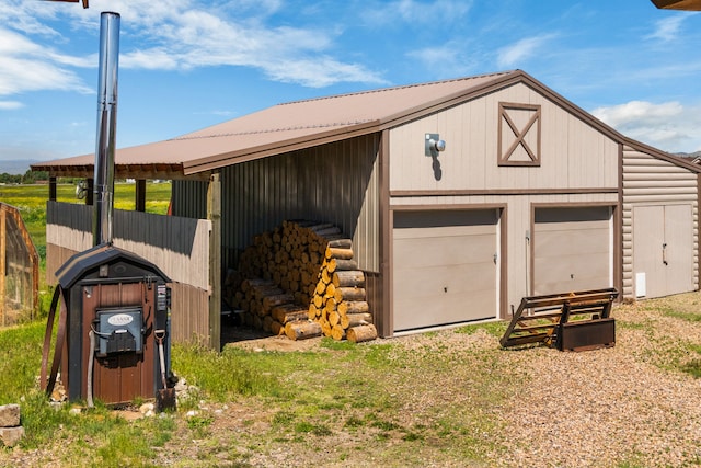 68 Bieler Ln, Sheridan, MT 59749 - view of side of home featuring an outbuilding, a garage, and driveway
