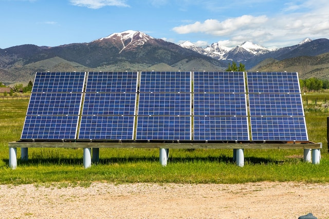 68 Bieler Ln, Sheridan, MT 59749 - view of side of home featuring ground mounted solar panels and a mountain view