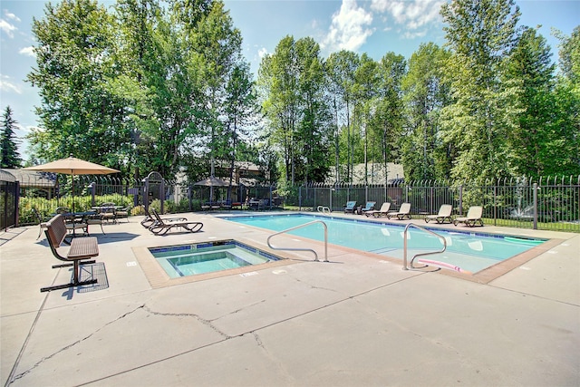 1750 E Lakeshore Dr Unit 203, Whitefish, MT 59937 - community pool featuring a patio area, a community hot tub, and view of scattered trees