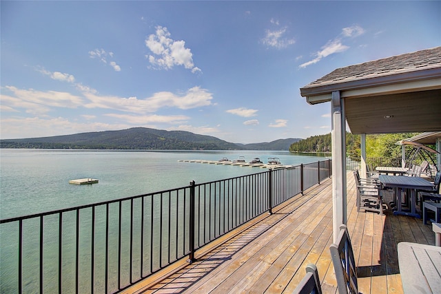 1750 E Lakeshore Dr Unit 203, Whitefish, MT 59937 - wooden deck with a water and mountain view