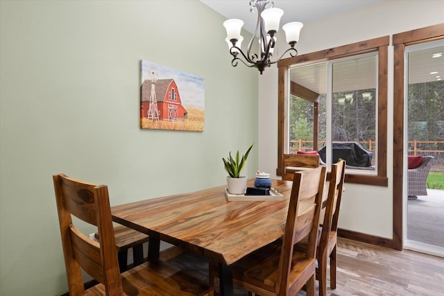 388 Cherry Creek Rd, Thompson Falls, MT 59873 - dining area featuring a chandelier and wood finished floors