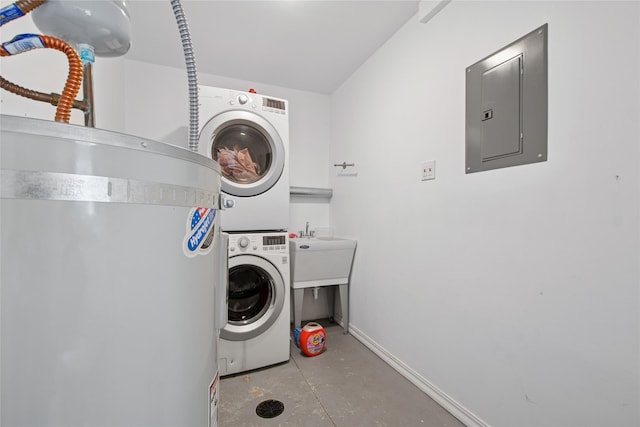 227 Jackson Peak Dr, Kalispell, MT 59901 - laundry room with laundry area, electric panel, stacked washer / dryer, a sink, and baseboards