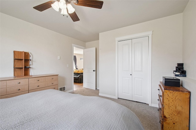 227 Jackson Peak Dr, Kalispell, MT 59901 - bedroom with visible vents, ceiling fan, a closet, and light carpet