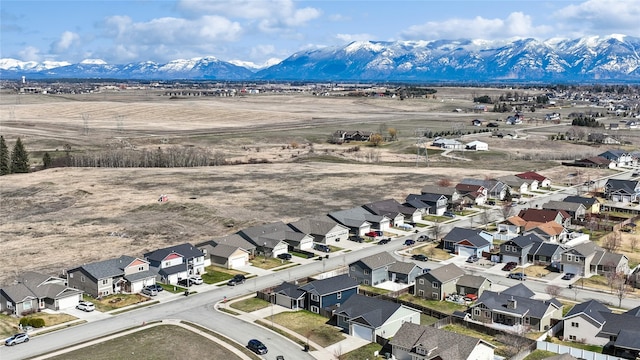 227 Jackson Peak Dr, Kalispell, MT 59901 - drone / aerial view with a residential view and a mountain view