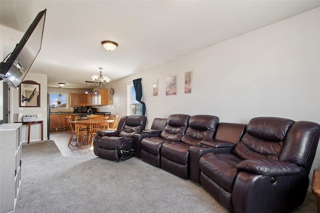 227 Jackson Peak Dr, Kalispell, MT 59901 - living room featuring an inviting chandelier and light carpet