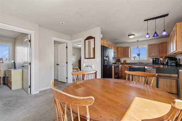 227 Jackson Peak Dr, Kalispell, MT 59901 - dining room featuring light colored carpet and baseboards