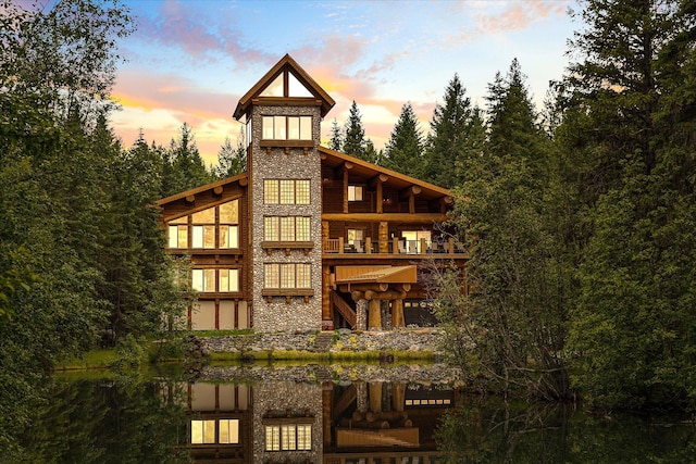 3700 Glen Lake Rd, Eureka, MT 59917 - back of property with stone siding and a balcony