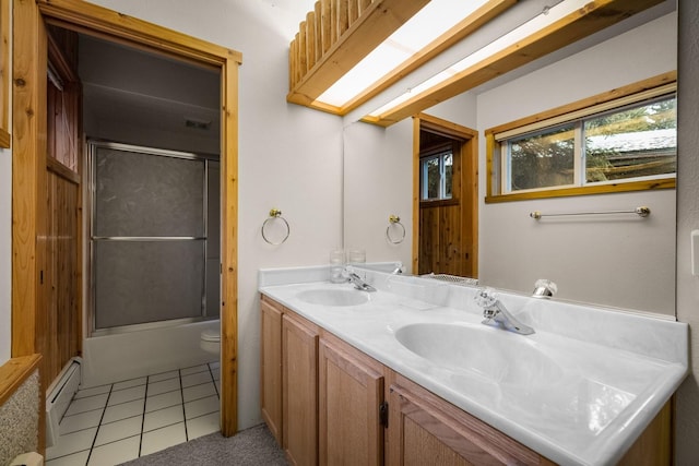 3700 Glen Lake Rd, Eureka, MT 59917 - full bathroom featuring double vanity, baseboard heating, enclosed tub / shower combo, and tile patterned flooring