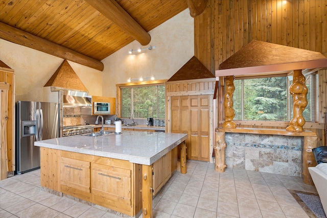 3700 Glen Lake Rd, Eureka, MT 59917 - kitchen featuring stainless steel refrigerator with ice dispenser, an island with sink, high vaulted ceiling, a wooden ceiling with exposed beams, and plenty of natural light