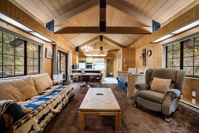 3700 Glen Lake Rd, Eureka, MT 59917 - living room featuring dark carpet, a chandelier, wooden walls, and baseboard heating